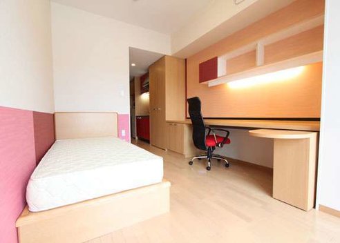 Bed, bookshelf, and desk